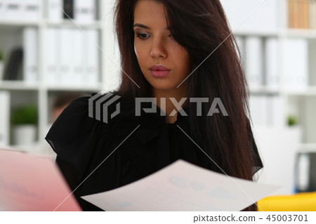 Beautiful smiling brunette woman sit at table Beautiful smiling brunette woman sit at table 45003701