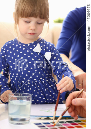 Blond smiling little girl hold in arm brush 45004678