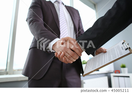 Man in suit shake hand as hello in office 45005211