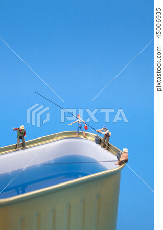 Miniature people fishing on cans Miniature people fishing on cans 45006935