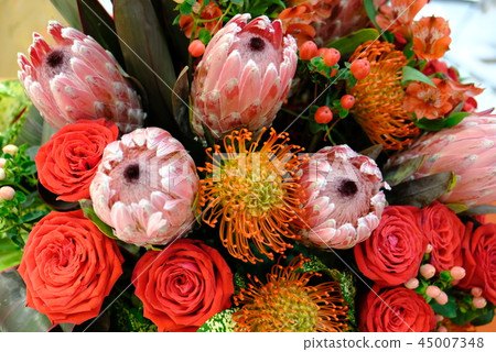 Luxury bouquet of fresh flowers protea and roses. Luxury bouquet of fresh flowers protea and roses. 45007348