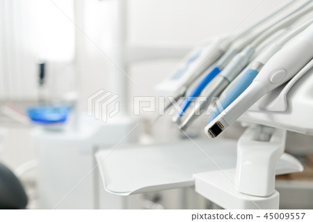 Stomatological instrument in the dentists clinic. Dental work in clinic. Operation, tooth Stomatological instrument in the dentists clinic. Dental work in clinic. Operation, tooth 45009557