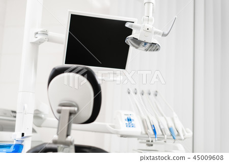 Modern led lamp in the dentists clinic. Dental work in clinic. Operation, tooth replacement 45009608
