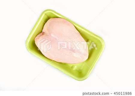 Raw chicken breast in a tray on a white background. 45011986