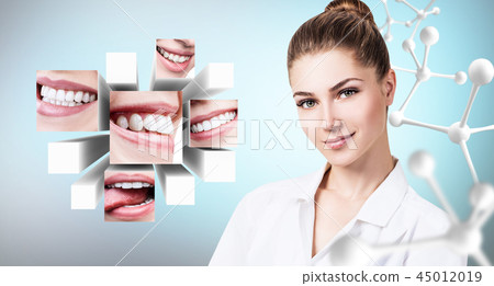 Young dentist doctor near collage of healthy beautiful smiles. 45012019