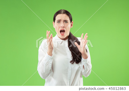 Portrait of the scared woman on green Portrait of the scared woman on green 45012863