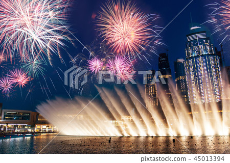 Fireworks over Dubai mall fountain show Fireworks over Dubai mall fountain show 45013394