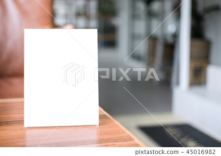 Mock up blank menu frame on table in coffee shop stand for your Mock up blank menu frame on table in coffee shop stand for your 45016982