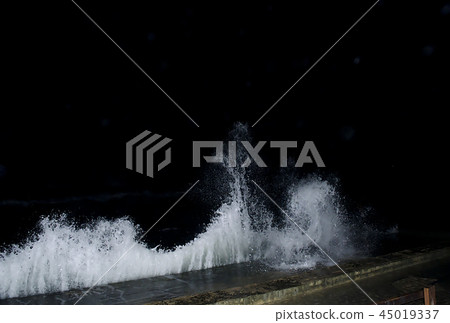 Splashing wave on the Black sea in the night. 45019337
