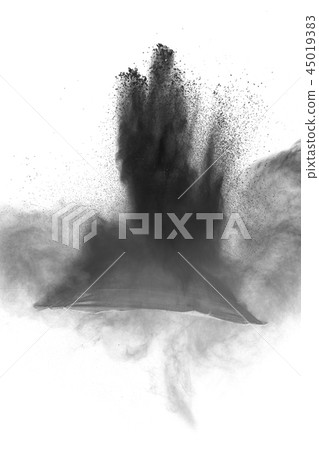 Black powder dust explosion on white background. Black powder dust explosion on white background. 45019383