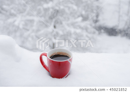 Red cup of coffee outdoor in snow 45021852