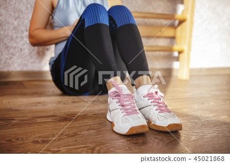 Sport shoes of tired girl Sport shoes of tired girl 45021868