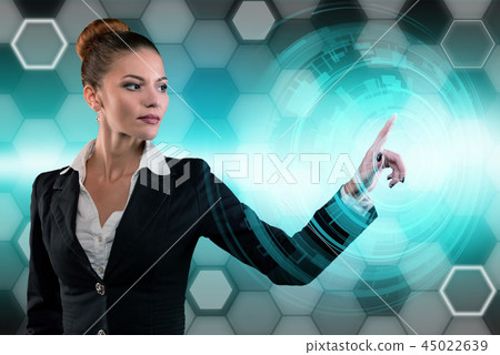 Young business lady works with virtual graphic interface in futuristic office 45022639