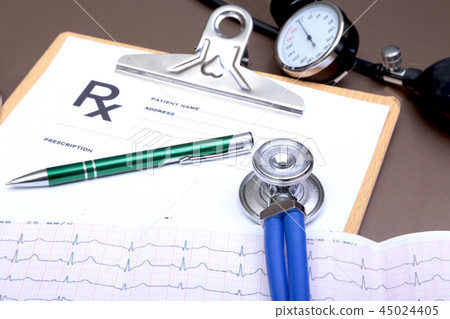 RX prescription, Red heart, asorted pils and a stethoscope on white background 45024405