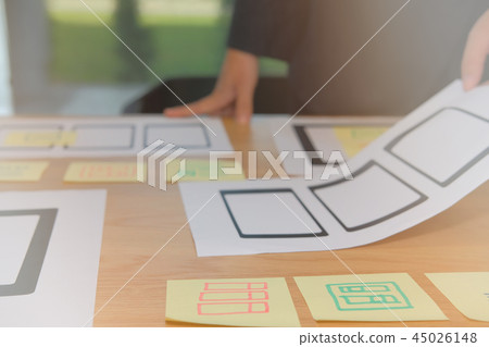 user experience UX designer designing web on smartphone tablet layout. UI planning mobile application. developer work with business prototype user experience UX designer designing web on smartphone tablet layout. UI planning mobile application. developer work with business prototype 45026148