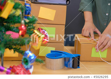 startup business owner packing cardboard box. man seller prepare parcel box for delivery. Online selling, e-commerce concept 45026295