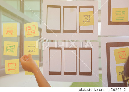 user experience UX designer designing web on mobile phone tablet layout. UI planning mobile application. developer work with business prototype user experience UX designer designing web on mobile phone tablet layout. UI planning mobile application. developer work with business prototype 45026342