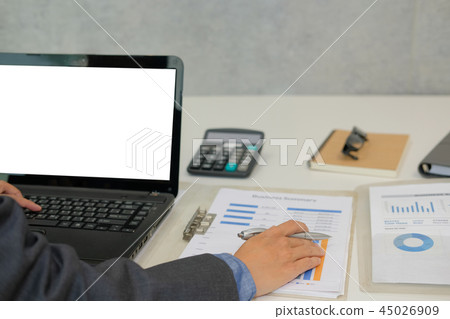 businessman working with document & computer. startup man analyze financial data at workplace. 45026909