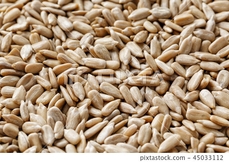 Sunflower seeds background. Organic vegan food. Sunflower seeds background. Organic vegan food. 45033112