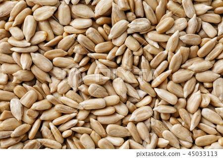 Sunflower seeds background. Organic vegan food. Sunflower seeds background. Organic vegan food. 45033113