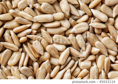 Sunflower seeds background. Organic vegan food. Sunflower seeds background. Organic vegan food. 45033114