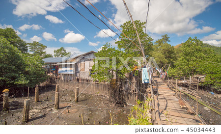 The bridge of the plaques in the poor district of Coron town. Busuanga. Views of the city's Slums The bridge of the plaques in the poor district of Coron town. Busuanga. Views of the city's Slums 45034443