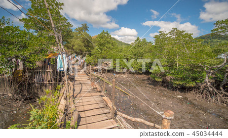 The bridge of the plaques in the poor district of Coron town. Busuanga. Views of the city's Slums The bridge of the plaques in the poor district of Coron town. Busuanga. Views of the city's Slums 45034444