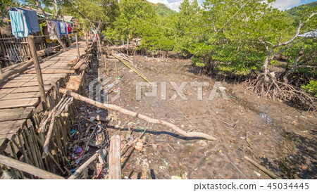 The bridge of the plaques in the poor district of Coron town. Busuanga. Views of the city's Slums The bridge of the plaques in the poor district of Coron town. Busuanga. Views of the city's Slums 45034445
