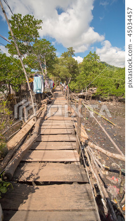 The bridge of the plaques in the poor district of Coron town. Busuanga. Views of the city's Slums The bridge of the plaques in the poor district of Coron town. Busuanga. Views of the city's Slums 45034457