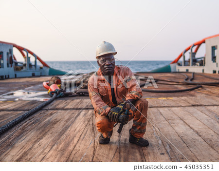 Seaman AB or Bosun on deck of offshore vessel or ship Seaman AB or Bosun on deck of offshore vessel or ship 45035351