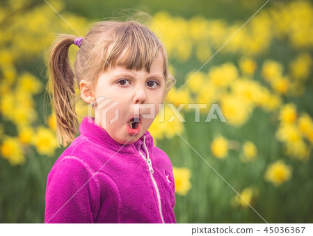 Portrait of a young mischievous girl Portrait of a young mischievous girl 45036367