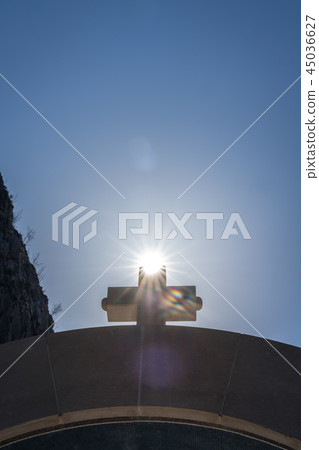 Cross on top of arched gates Cross on top of arched gates 45036627
