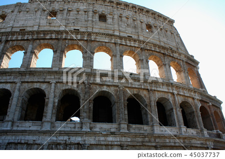 Coloseum against bright blue sky in Rome Italy 45037737
