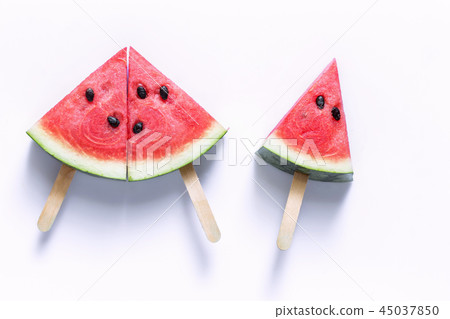 Watermelon sliced into a slice of wood  45037850