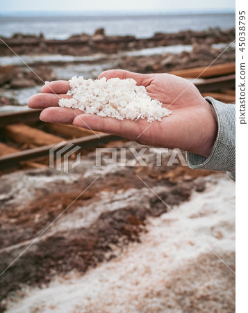 salt in hand extraction old rusty railroad tracks  45038795