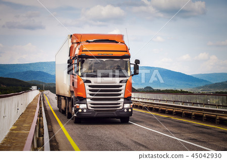 Orange truck on a road Orange truck on a road 45042930