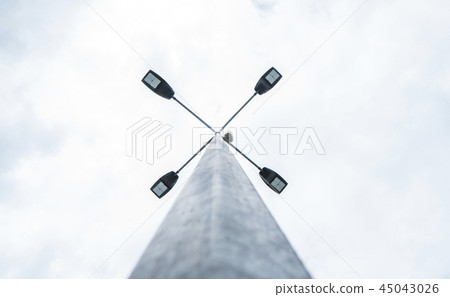 Street light in daytime and blue sky with clouds. Street light in daytime and blue sky with clouds. 45043026