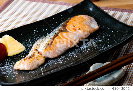 Salmon grilled with salt in Japanese style . Salmon grilled with salt in Japanese style . 45043045