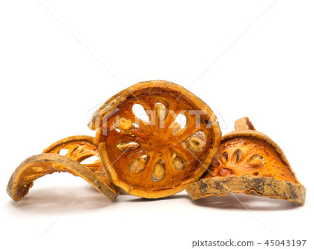 slices of dried bael fruit. 45043197