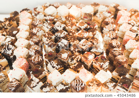 Different kinds of baked sweets on a buffet Different kinds of baked sweets on a buffet 45043486