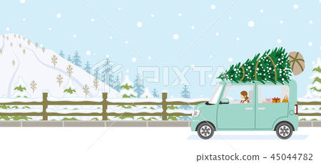 Young woman riding a car loaded with fir trees-winter snowy road 45044782