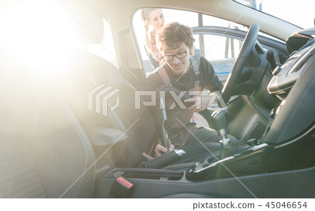 Man cleaning inside of car Man cleaning inside of car 45046654