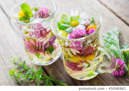 Two glass mugss of healthy herbal tea.  45046961