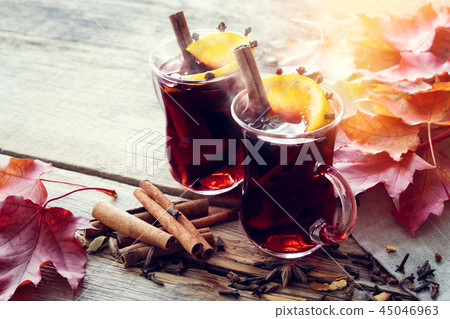 Glass mugs of mulled wine with spices. 45046963