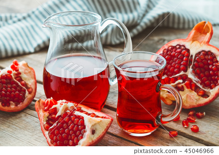 Pomegranate juice and pomegranate fruit. Pomegranate juice and pomegranate fruit. 45046966