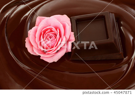 Melted chocolate dripping with chocolate bar Melted chocolate dripping with chocolate bar 45047871