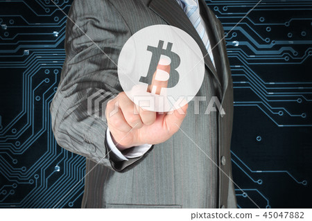 Businessman pushing button with Bitcoin symbol Businessman pushing button with Bitcoin symbol 45047882