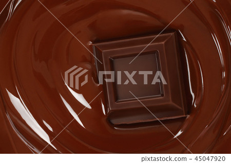Melted chocolate dripping with chocolate bar 45047920