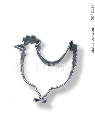 Chicken shaped pastry cutter on white surface 45048182
