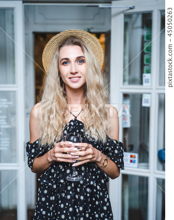 Girl with a glass of wine 45050263